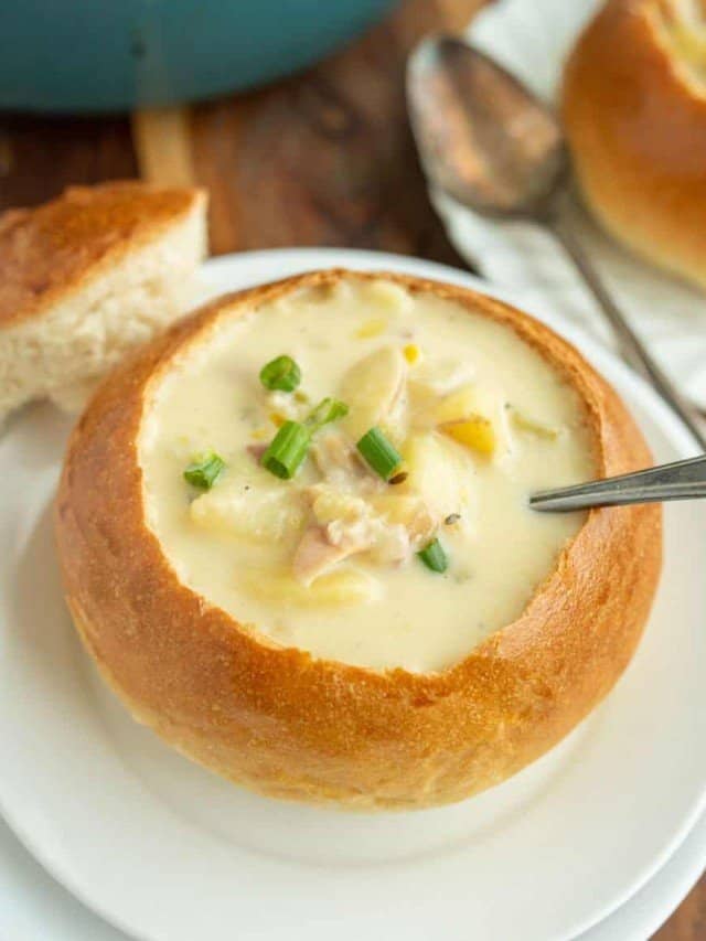 bread bowl with soup and a spoon