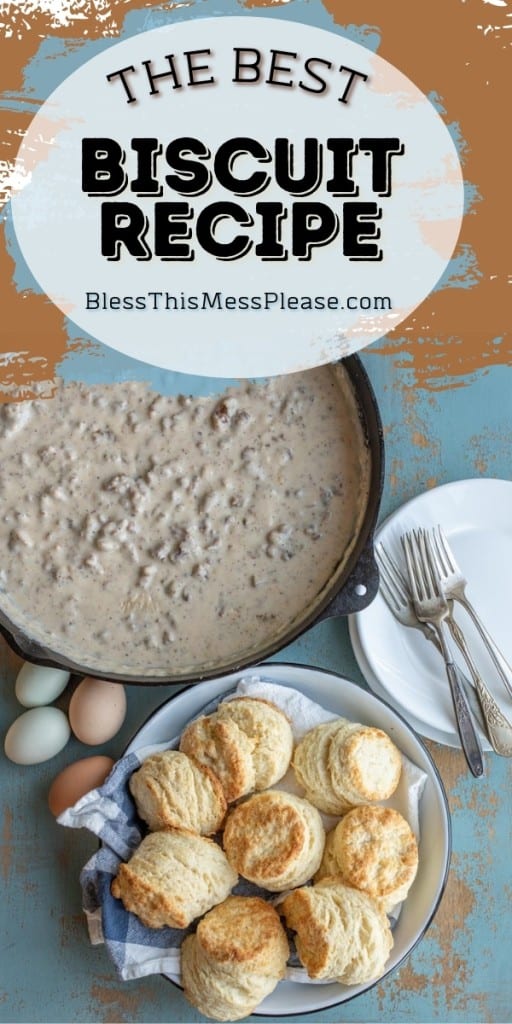 pinterest pin with title that reads "The Best Biscuit Recipe" plate of rustic homemade baked biscuit and a cast iron skillet of gravy in the background