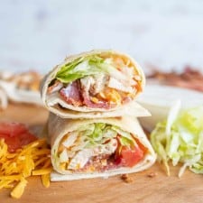close up of the sliced end of the chicken wrap with bacon