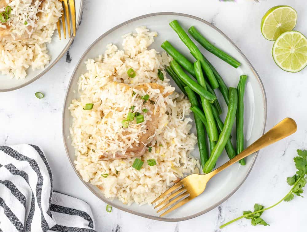 top view of a plate with green beans on the side garnished in chives