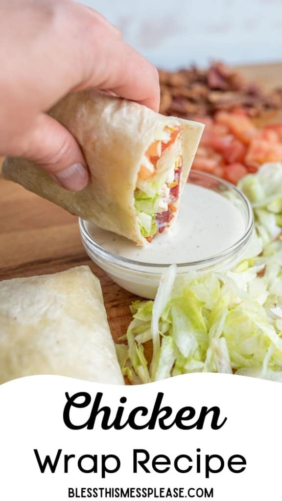 pinterest pin and the text reads "easy chicken wrap recipe" - POV of a hand dipping the chicken wrap into a dish of ranch