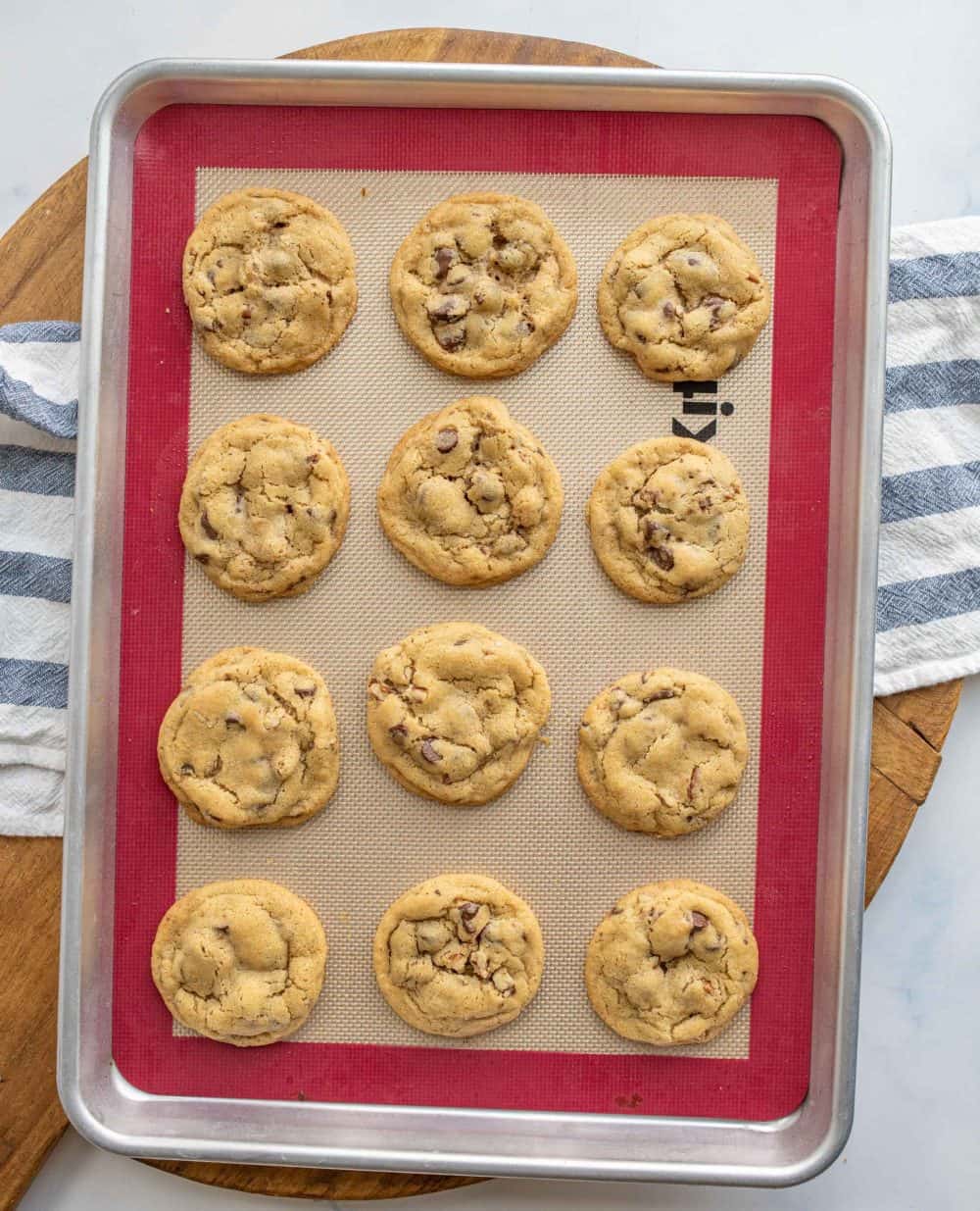 top view of rows of chocolate chip cookies complete on a baking dish