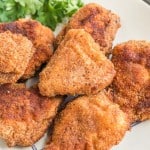 close up of crispy fried and golden homemade chicken nuggets.