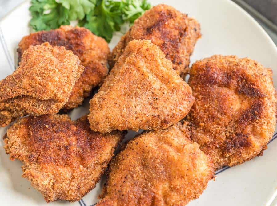 close up of crispy fried and golden homemade chicken nuggets.