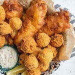 crispy deep fried and beer battered fish and hush puppies