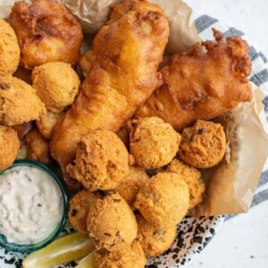 crispy deep fried and beer battered fish and hush puppies