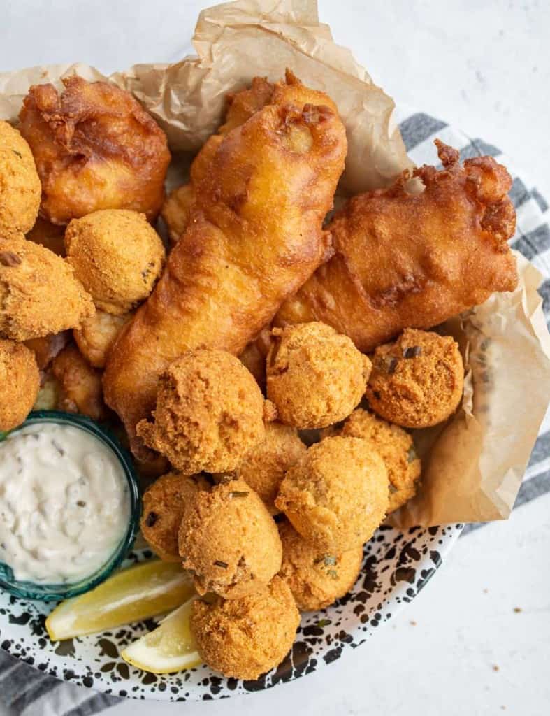 crispy deep fried and beer battered fish and hush puppies