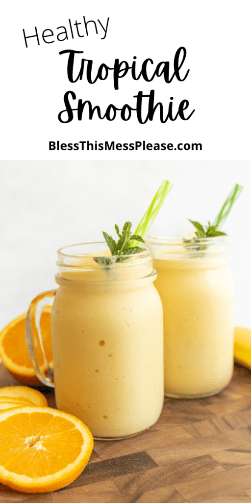 pin that reads "healthy tropical smoothie" and shows yellow frozen tropical fruit smoothie in mason jars with handles