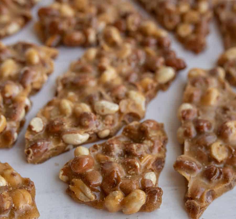 homemade peanut brittle close up on parchment