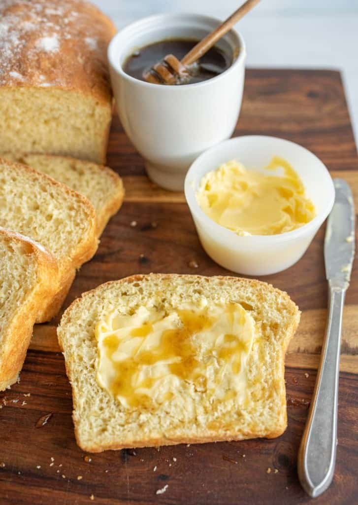butter and honey on sliced airy potato bread