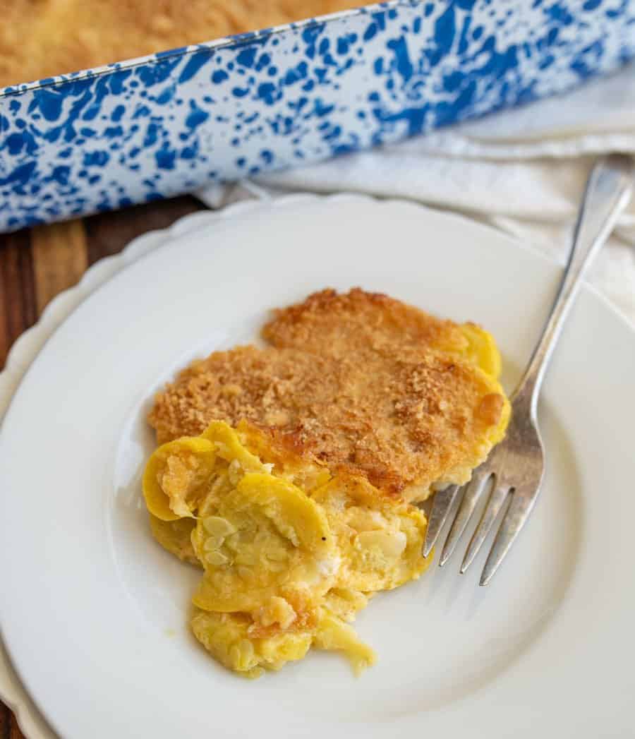 white plate next to a photo of a blue spotted baking dish with a piece of crumbly topped yellow casserole