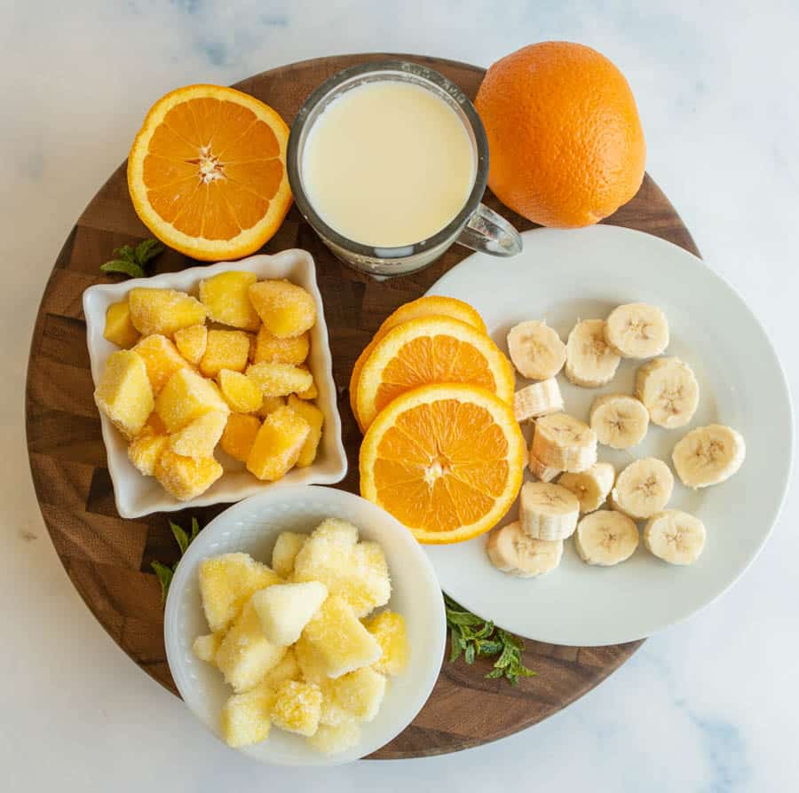 top view of tropical fruit and ingredients for a smoothie