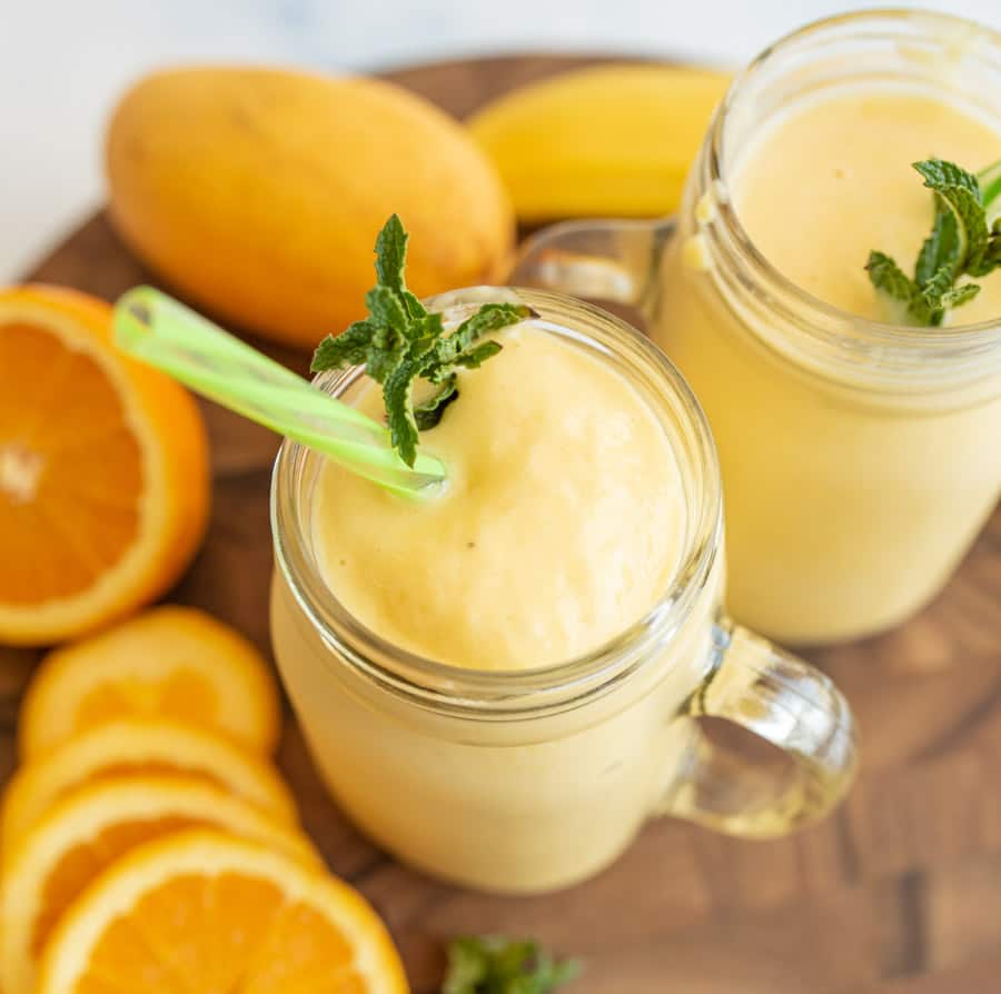 homemade tropical smoothie top view in a mason jar with a handle