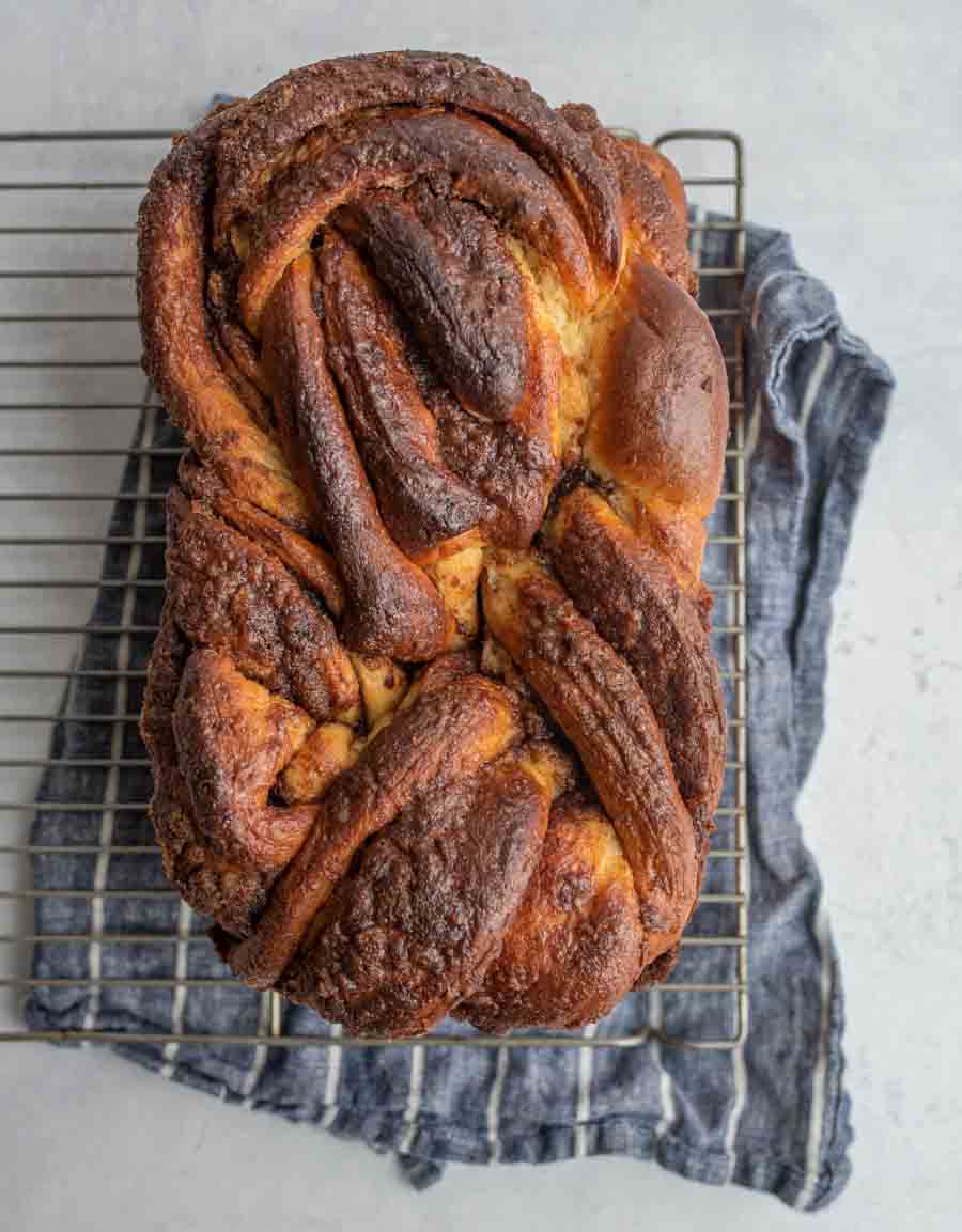 top view of the whole loaf of cinnamon bread on cooling rack