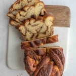 top view of a sliced loaf of cinnamon bread sliced half way