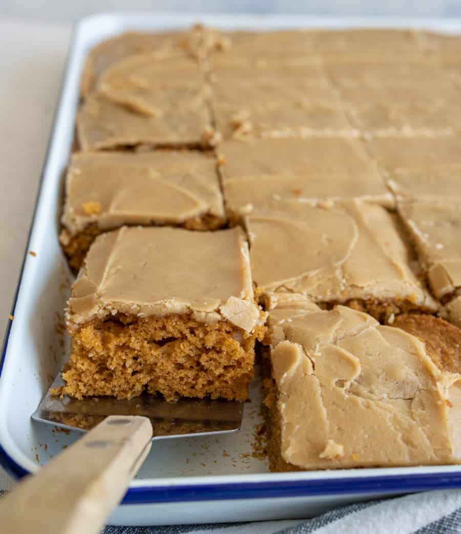 pumpkin cake in a sheet pan with a caramel icing on top