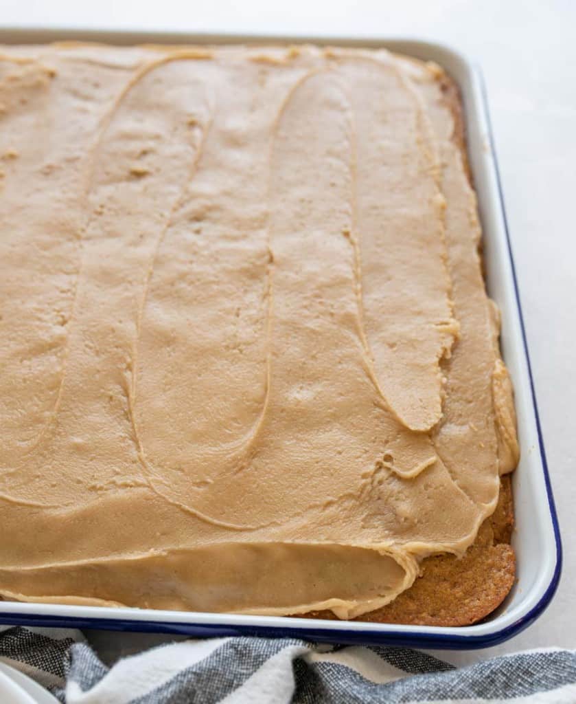 whole pumpkin cake in a sheet pan with caramel topping