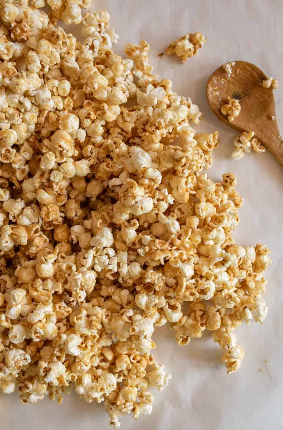 top view of soft caramel popcorn laid out on parchment paper