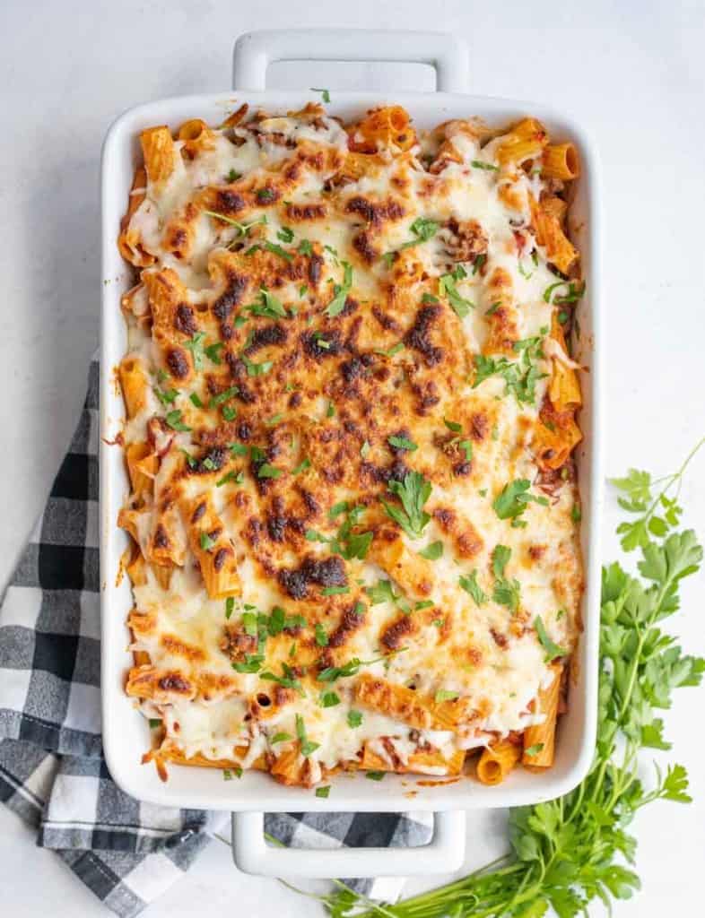 rigatoni pasta bake in a dish with cheese