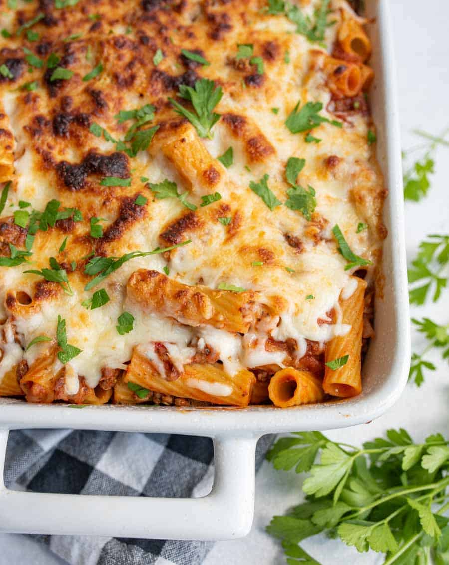 baking dish with cheese and rigatoni pasta