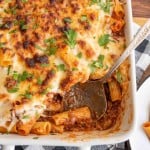 baking dish with cheese and rigatoni pasta
