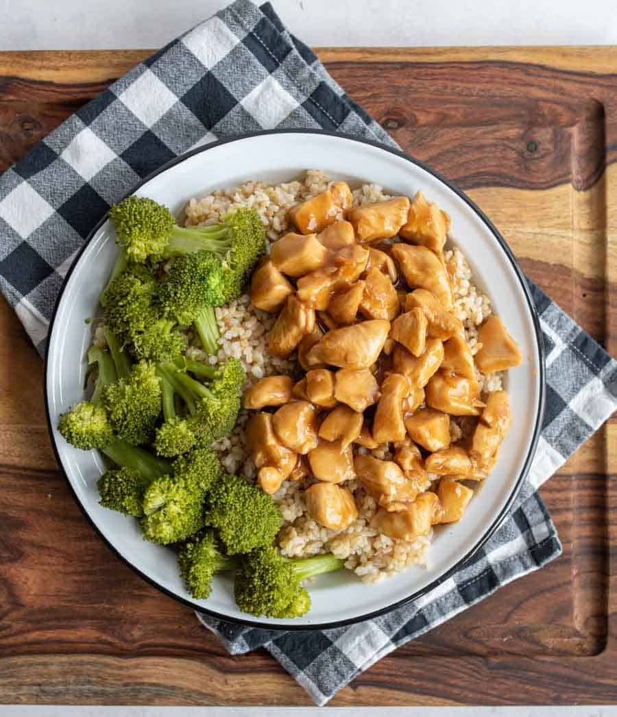 top view of teriyaki chicken pieces on a dinner plate