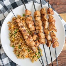 grilled chicken kabobs on a dinner plate