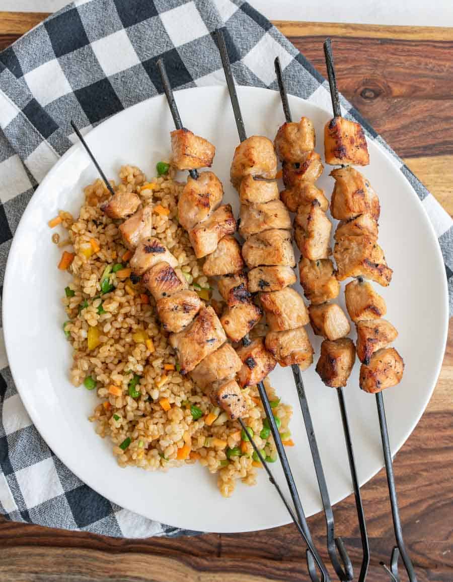 grilled chicken kabobs on a dinner plate