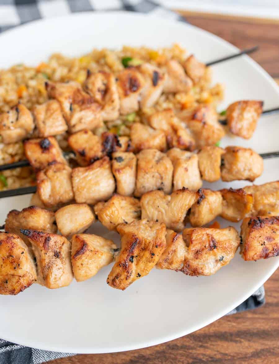 grilled chicken kabobs on a dinner plate