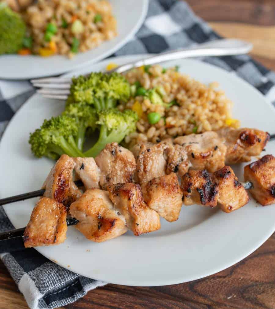 grilled chicken kabobs on a dinner plate