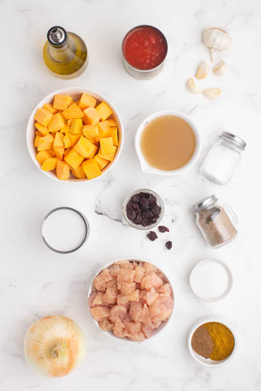 ingredients for pumpkin curry in separate small dishes