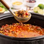 slow cooker and a ladle with taco soup