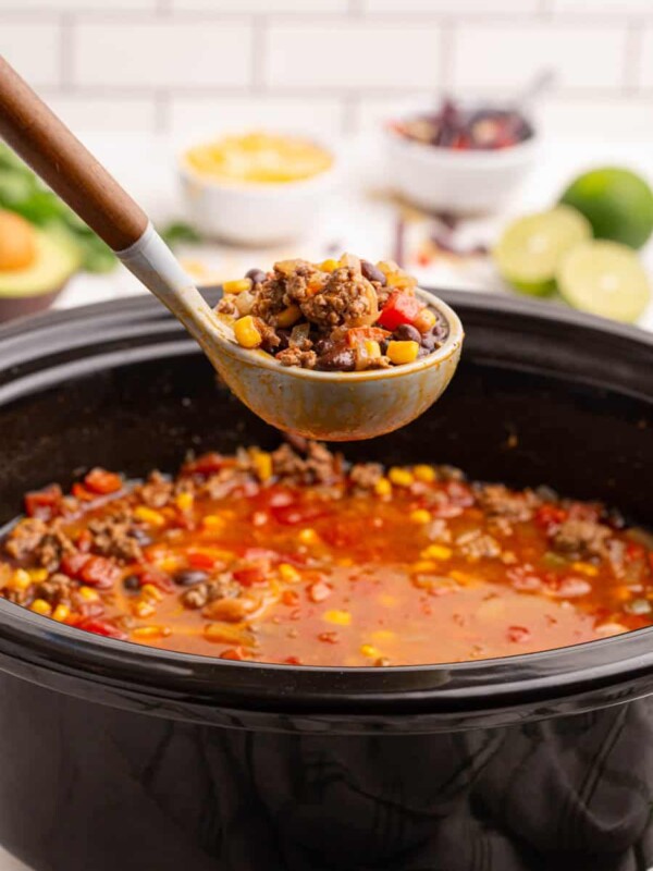 slow cooker and a ladle with taco soup