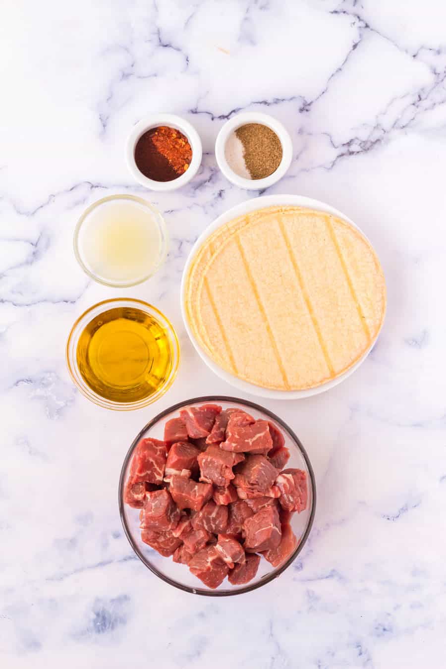 top view of ingredients of steak tacos