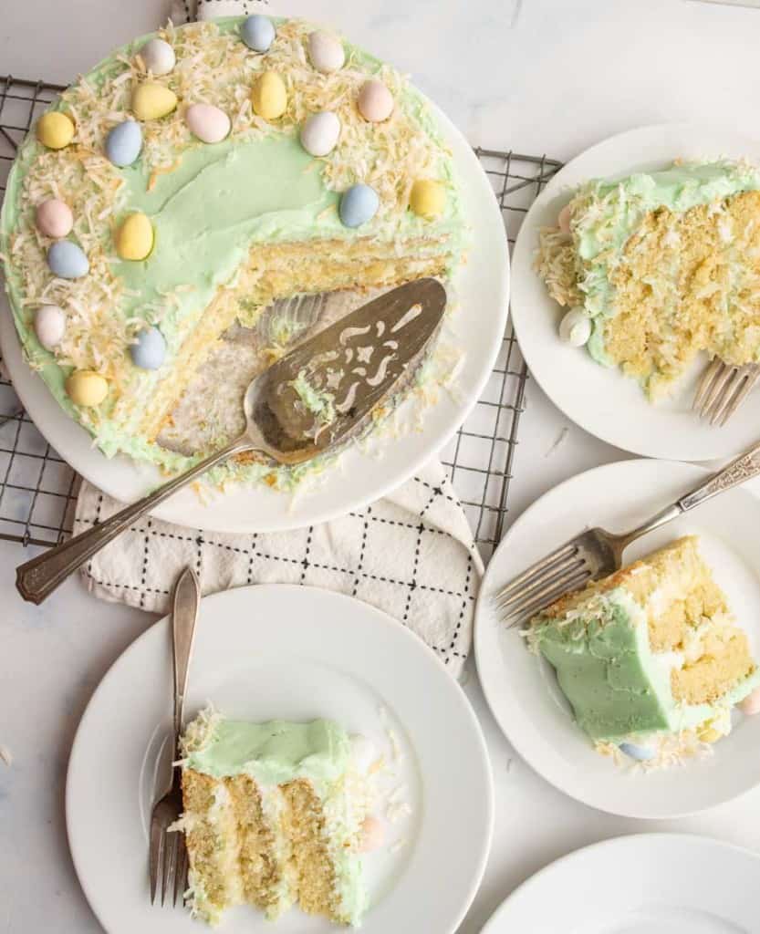 Top view of a coconut easter cake with slices taken out