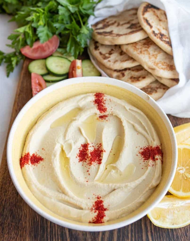 bowl of hummus with red spice on top