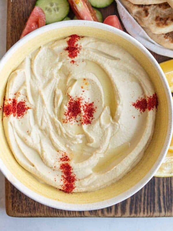 bowl of hummus with red spice on top