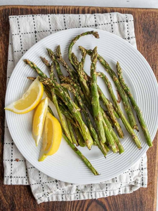 plated lemon and baked air fryer asparagus