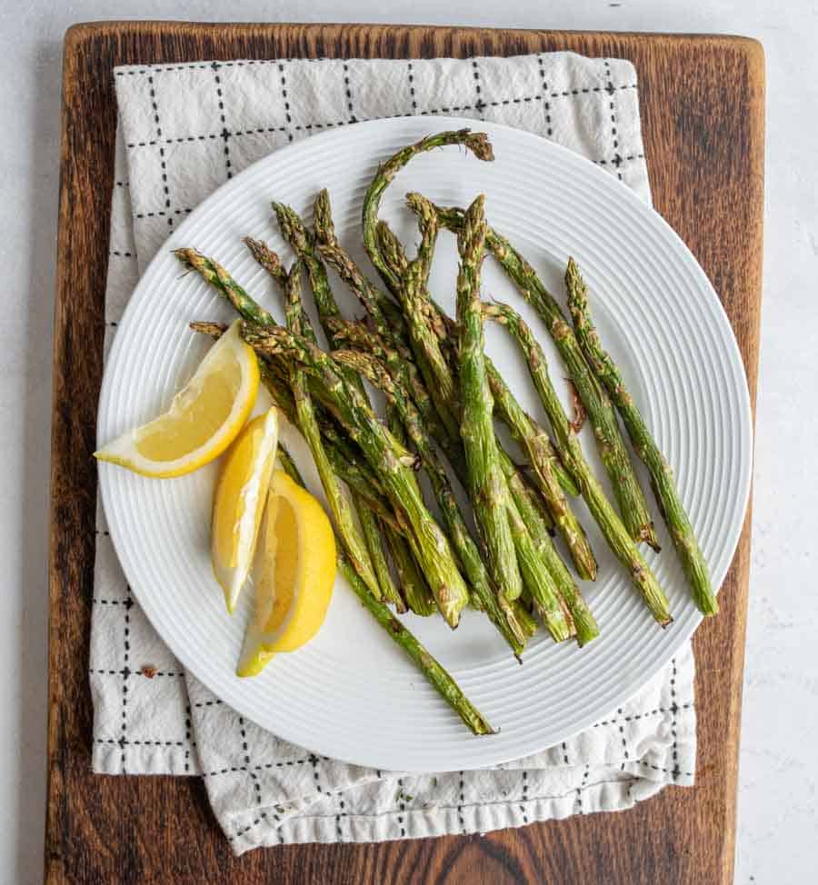 plated lemon and baked air fryer asparagus