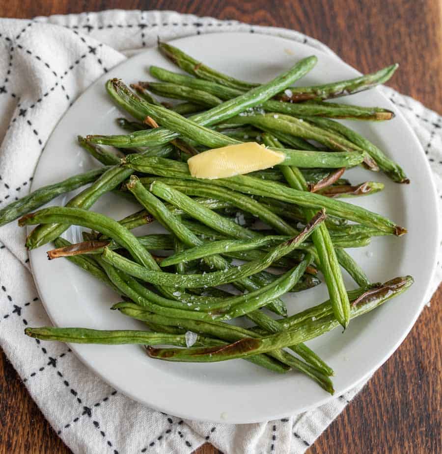 plated air fryer green beans with butter and salt