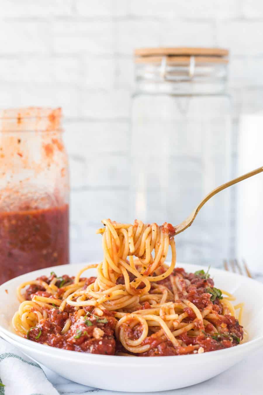 arrabbiata sauce over pasta on a white plate