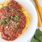 arrabbiata sauce over pasta on a white plate close up