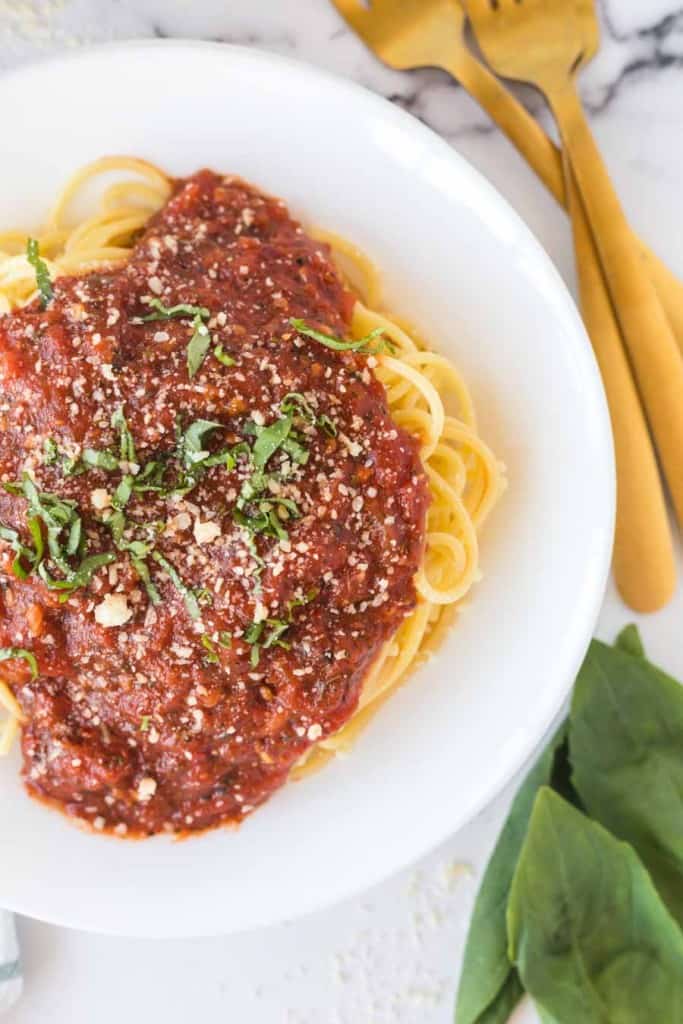 arrabbiata sauce over pasta on a white plate close up
