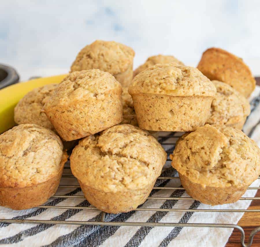 stack of banana bread muffins on a cooling rack