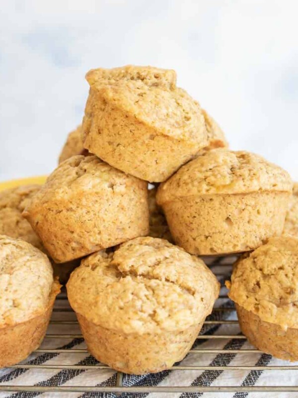 stack of banana bread muffins on a cooling rack
