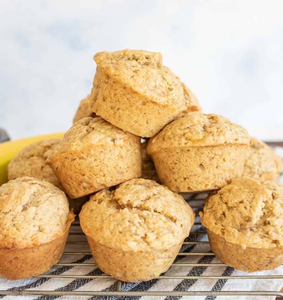 stack of banana bread muffins on a cooling rack