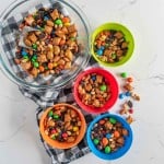 multi colored bowls filled with trail mix