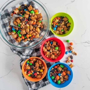 multi colored bowls filled with trail mix