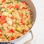 chicken and rice with zucchini in the pan