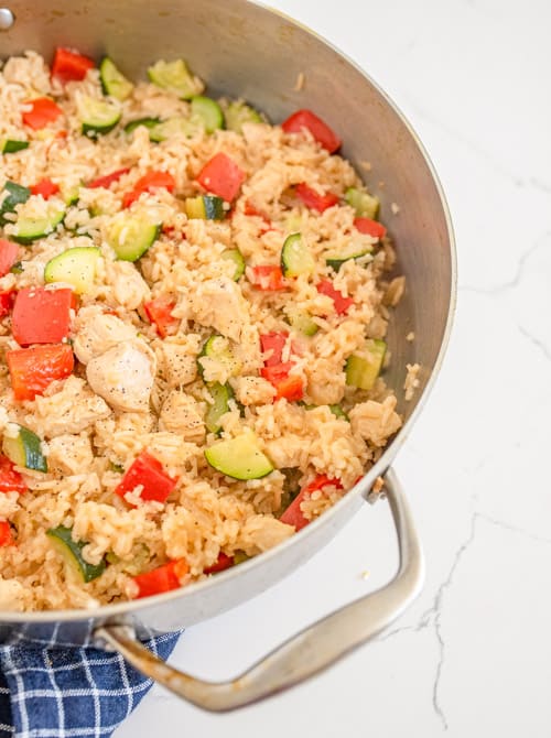 chicken and rice with zucchini in the pan